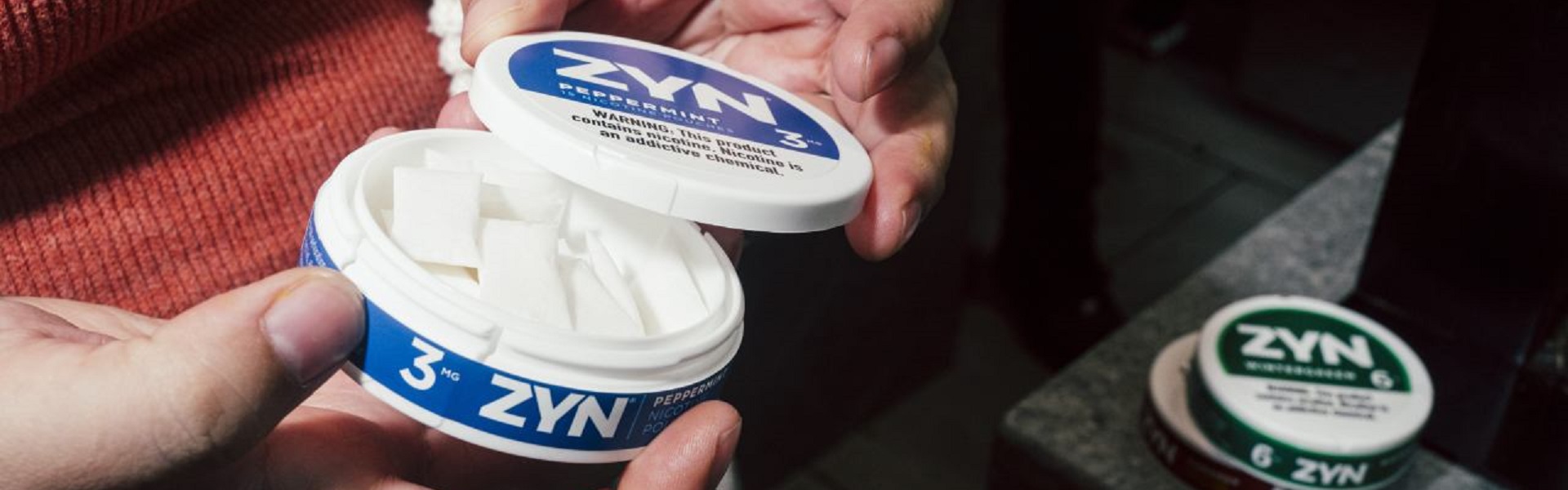 Hand holding ZYN 3mg Peppermint Nicotine Pouch – Discreet and Tobacco-Free